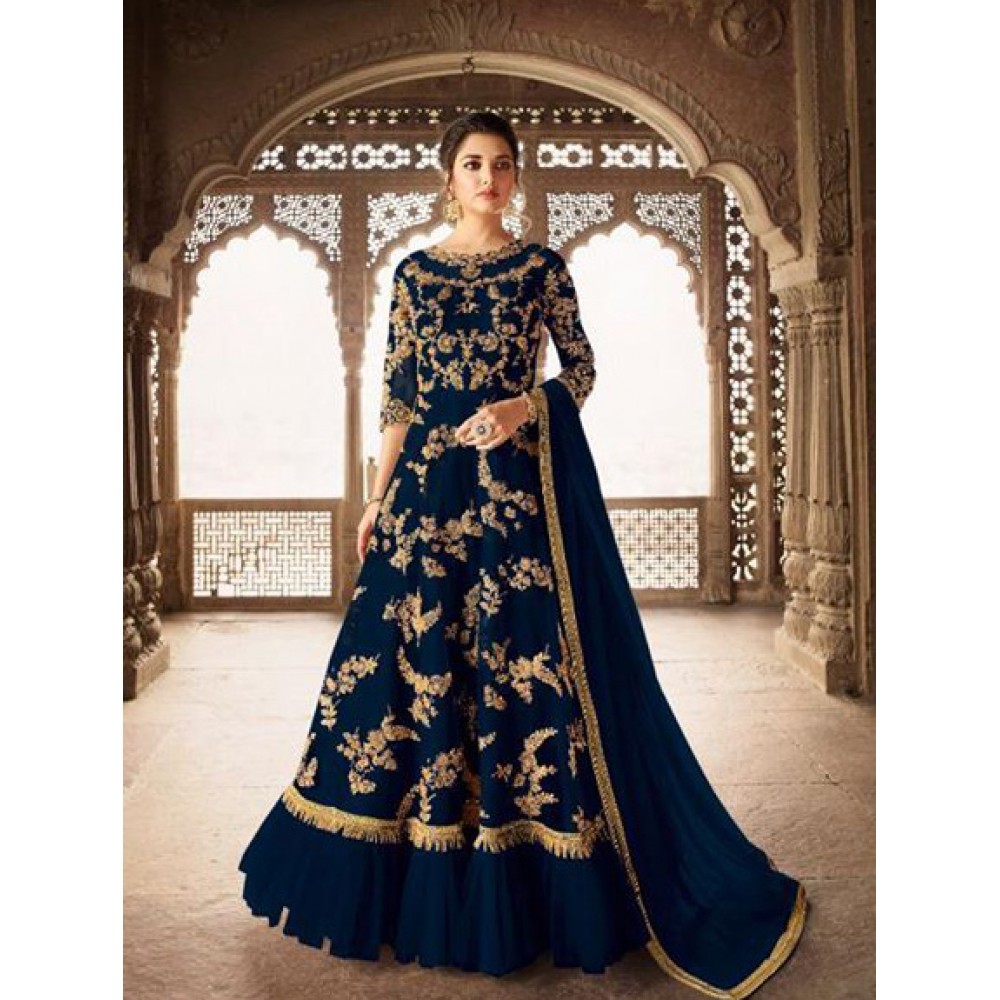 navy and gold indian dress Not every outfit earns a second look and a compliment. This navy blue silk corset lehenga earns both, every single time. Whether you're dancing at the sangeet or tearing up during the